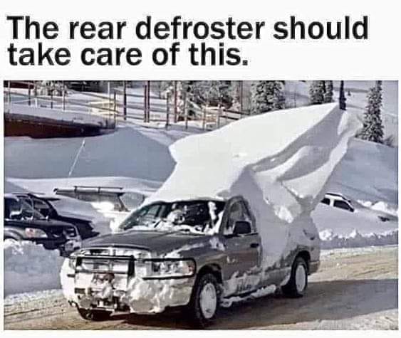 pickup truck in snow with a huge amount of snow in the bed of the truck and on top of the cab with the caption "the rear defroster should take care of this."